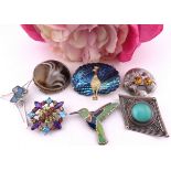 Seven brooches, including four in sterling silver. A varied group comprising four sterling silver