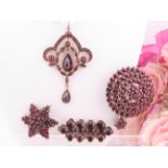 Sterling silver and pinchbeck garnet set jewellery. A group of antique and vintage garnet set