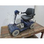 Mobility scooter in blue with battery charger and basket, untested