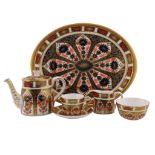 A Royal Crown Derby miniature teaset decorated in the Imari palette, pattern 1128, comprising teapot