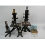 Pair of vintage compound microscopes with accessories and microscope slides, comprising quality scie