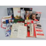 A mixed collection of sporting memorabilia, predominantly football related, including match