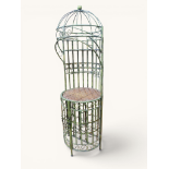 Tall metal wine rack with scrolled decoration and wicker shelf, green painted finish, height 74in, w