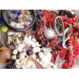 A mixed costume jewellery lot comprising assorted bead necklaces, bracelets, bangles and