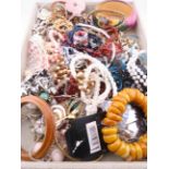 A mixed costume jewellery lot comprising various costume necklaces, bangles, bracelets, brooches and