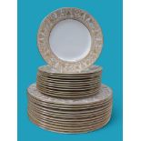 A collection of Wedgwood Gold Florentine dinnerware, comprising twelve dinner plates and twelve side