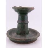 A Chinese Shiwan ware green-glazed ceramic oil lamp or candlestick, Qing Dynasty approx. 3.5 in.