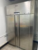 Gram 2 door stainless steel upright fridge Note this lot has a lift out charge see charges in