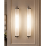 A pair of premium contemporary linear bathroom wall sconces of sleek, architectural form, Each