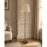A Neoclassical Style Antique Brass Swing-Arm Library / Floor Lamp The library standard lamp features