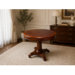 A Regency Style Mahogany Oval Writing Table and Coordinating Hepplewhite Style Shield-Back Chair The