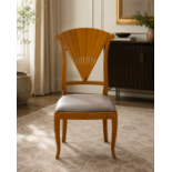 A Contemporary Pair of Art Deco Revival Wingback Accent Chair and Matching Footstool An elegant