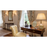 A Regency style Rosewood writing desk The moulded top inlaid with boxwood is supported by a simple