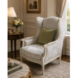 A Louis XVI Style Carved Beechwood Wingback Armchair (Bergère à Oreilles) A high-back winged