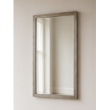 A Modern Silvered Rectangular Vanity Mirror A sleek wall or vanity mirror featuring a vertical,