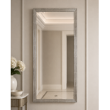 A Large Stepped Silver Mirror : A sophisticated Art Deco-inspired stepped wood frame finished in a