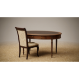 A Regency Style Mahogany Oval Writing Table and Coordinating Chair The grand oval top surface is