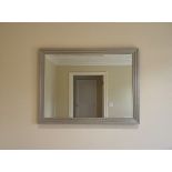 A large contemporary silver mirror A sophisticated Art Deco-inspired stepped wood frame finished