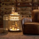 Timothy Oulton Shimmer Short Round Bar Cabinet in Flat Brass & Faceted Glass is a glamorous, low-