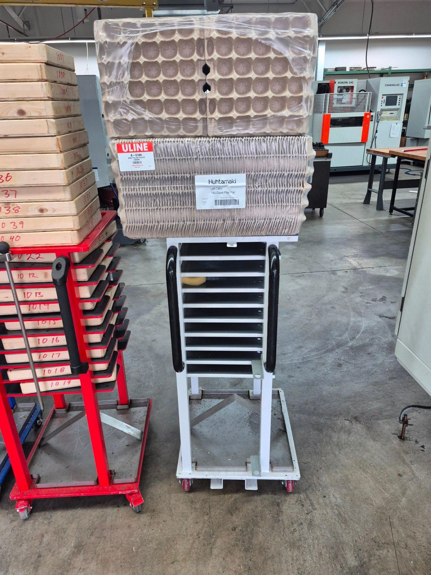6 X 9 TRAY COMMERCIAL TRAY RACKS ON CASTORS, FILLED WITH PACKING ...