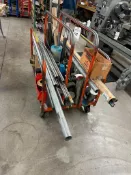6 WHEEL SHEET MATERIAL SHOP CART LOADED WITH MISC. METALS ROUND BAR STOCK AND ROUND METALS OFF CUTS.