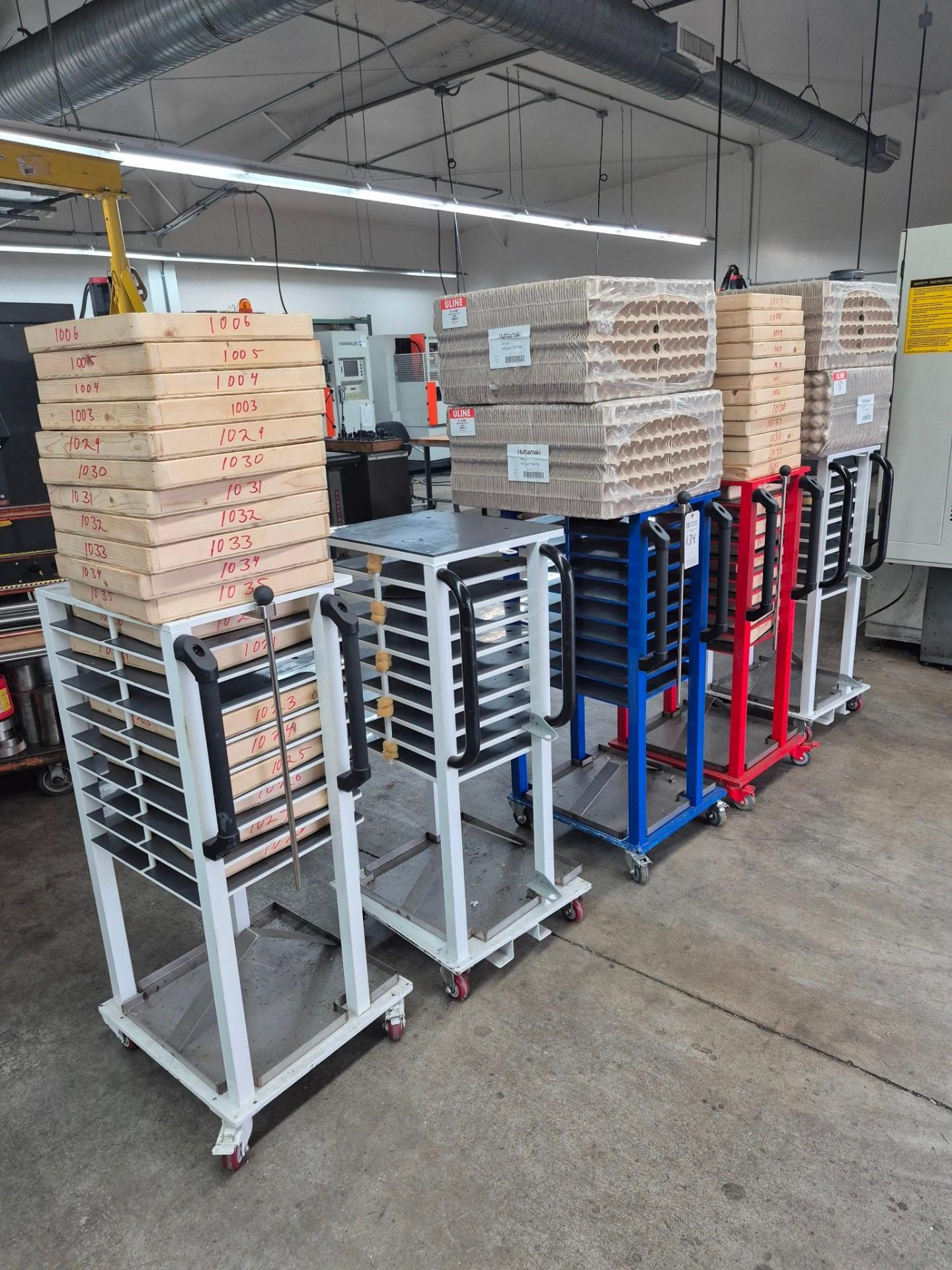 6 X 9 TRAY COMMERCIAL TRAY RACKS ON CASTORS, FILLED WITH PACKING ...
