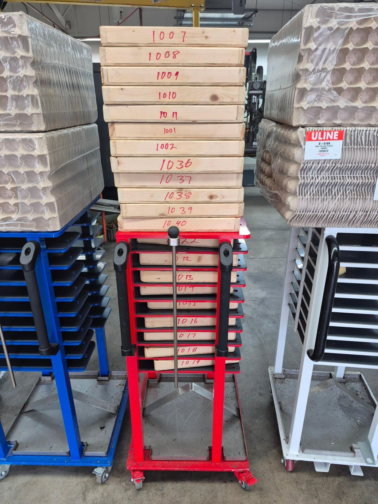 6 X 9 TRAY COMMERCIAL TRAY RACKS ON CASTORS, FILLED WITH PACKING ...