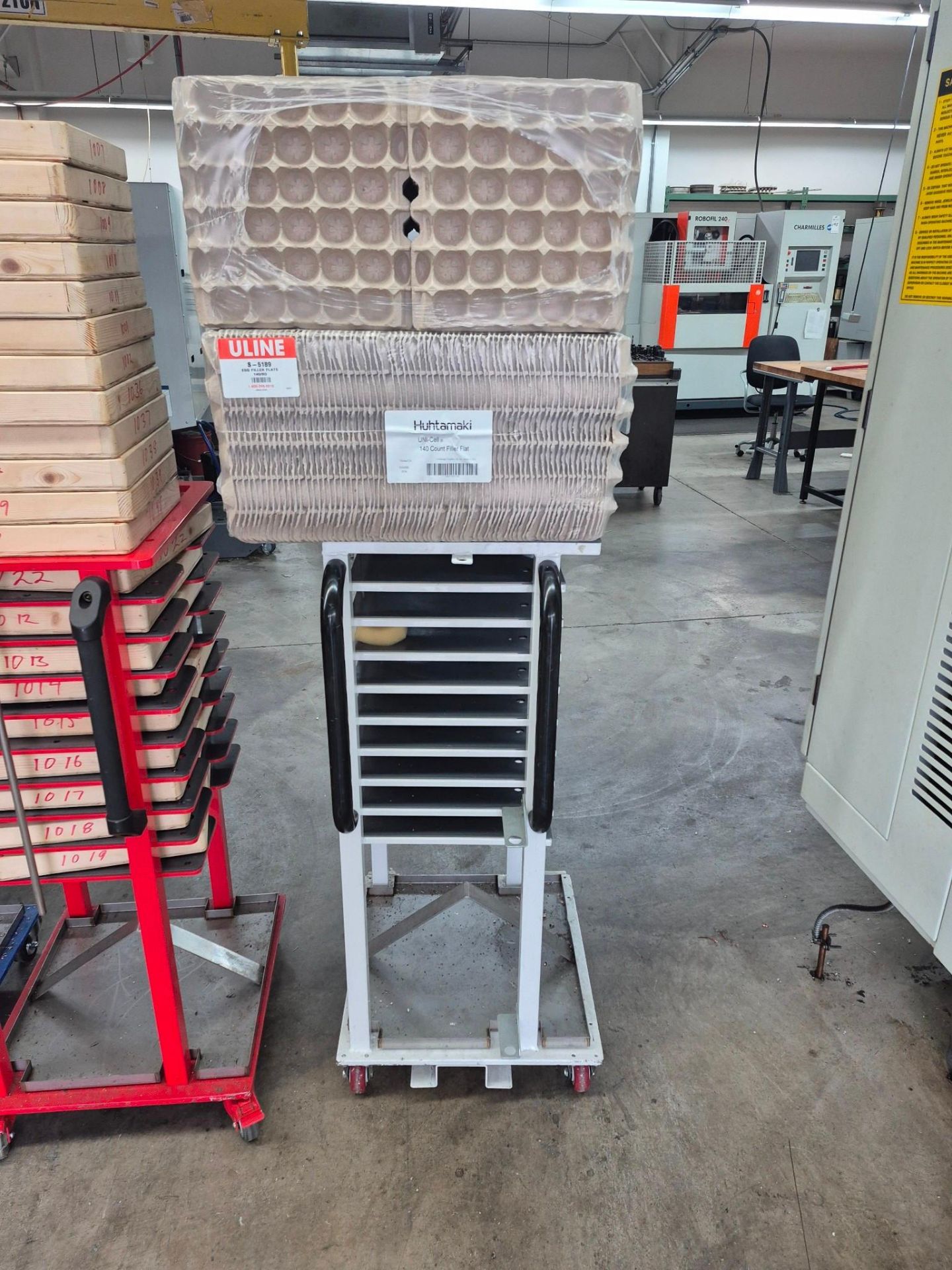 6 X 9 TRAY COMMERCIAL TRAY RACKS ON CASTORS, FILLED WITH PACKING ...