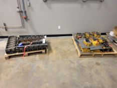LARGE LOT OF ASSORTED CATERPILLAR ENGINE CYLINDER HEADS
