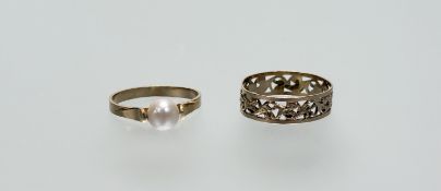 A 14ct gold ring with scrolling pierced border O 1.27g and a yellow metal cultured pearl ring