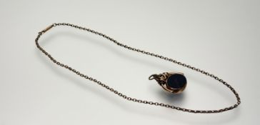 A Victorian 9ct gold revolving oval seal with bloodstone and opaque cornelian set panels: h. x 3cm