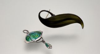 An Edwardian James Fenton Birmingham silver Arts and Crafts silver pendant with emerald green fish