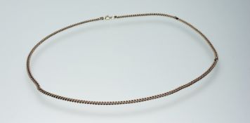 A 9ct gold kerb link necklace with ring fastening: l. x 26cm 14.05g