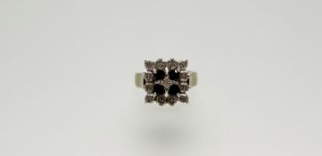 A 9ct gold ring set four circular faceted sapphires, approximately 0.07ct within a thirteen
