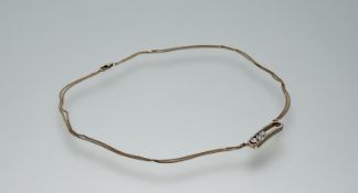 A modern 18ct rose gold bar style pendant on 18ct rose gold twin chains with lobster claw fastening,