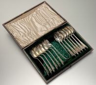 A Victorian set of twelve engraved tea spoons: l. x 13cm with initals M L J and matching set of