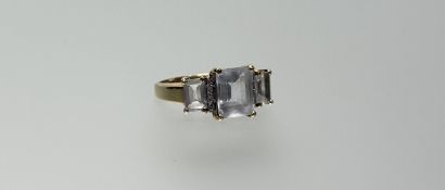 A 9ct gold cocktail ring set with a cushion cut pale aquamarine coloured stone approximately 1.5ct