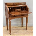 A modern French-style roll-top desk, three small drawers to top with brass inlay over roll-top