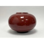 A Chinese vase of compressed bulbous form, with oxblood red glaze to exterior, and turquoise-green