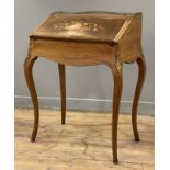 A late 19th century French bureau de dame, inlaid rosewood with serpentine front, gilt metal ledge