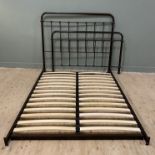 A contemporary metal double bed frame, arched headboard and footboard with slatted base, screws