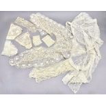 A group of 19th century lace including: a shawl or stole, worked with stylised floral motifs; a