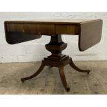 A Regency-style mahogany sofa table, rectangular top with drop leaves. fitted with three drawers