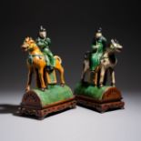 A pair of Chinese sancai-glazed stoneware 'Horseriders' roof tiles on later wooden stands, Ming