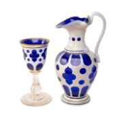 19TH C. BOHEMIAN WHITE OVERLAY BLUE GLASS EWER & GOBLET, ewer 26.5cms (h), goblet 18cms (h) (2)