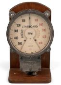 VINTAGE 'CIRSCALE' MARINE STARBOARD TACHOMETER, the dial showing a head in black and a stern in red,