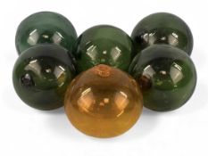 FIVE GREEN & ONE YELLOW GLASS FISHING FLOATS Provenance: private collection