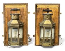 PAIR OF 19TH CENTURY BRASS SHIP'S LAMPS, with white enamel reflectors, mounted on oak boards, 58 x