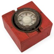 ANTIQUE MARINE BINNACLE COMPASS in brass case, with gimbal mount, 13.5cms (diam.), housed in a red