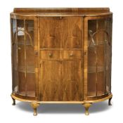 ART DECO STYLE WALNUT CABINET, with drop-down and cupboard centre, flanked by glazed convex doors,
